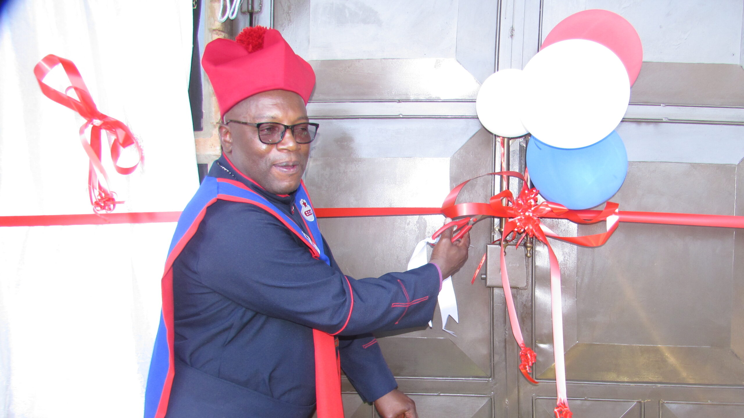 Bishop David Maeko of ZCM cutting a ribbon officially opening new church building photo by Dimakatso Modipa