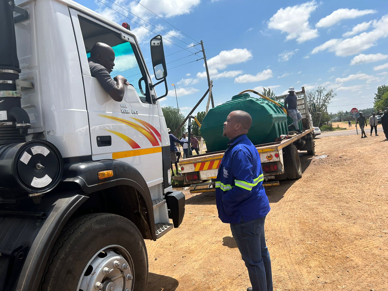 City of Tshwane MMC of human settlement MMC Ofentse Madzebatela talking to drivers who deliver water to residents. 