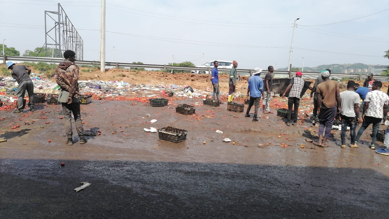 Informal traders of Marabastad clean up illegal dumping at Putco bus rank in Tshwane