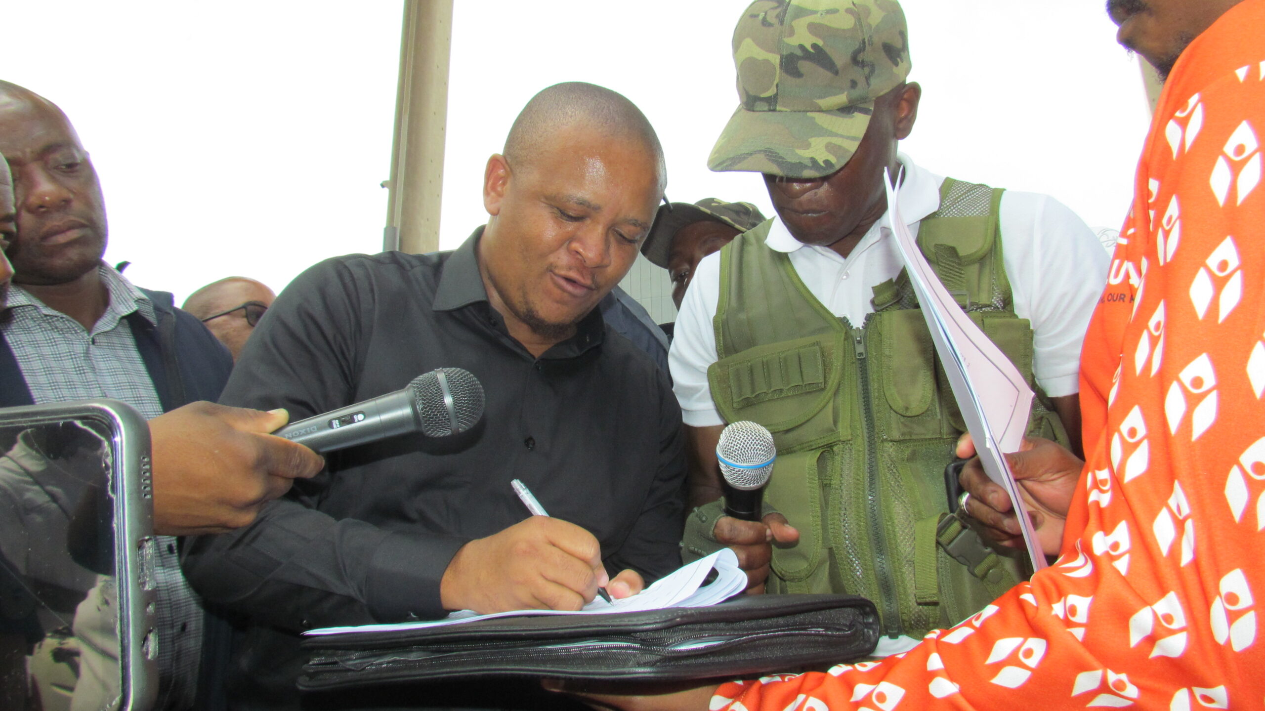 MMC for Human Settlements Ofentse Madzebatela sign a memorandum