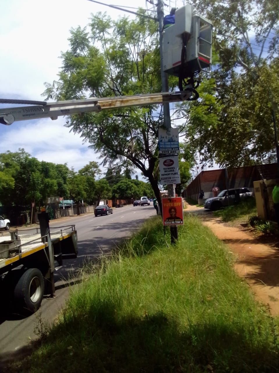 City of Tshwane officials mounted inside a Cherry Picker to cut off electricity supply to a household in Hatfield photo by Peter Mothiba