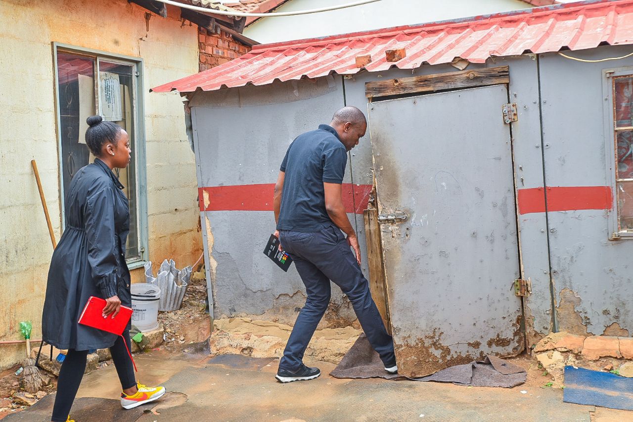 Rise Mzansi leader Songezo Zibi entering the shack of a lady tenant in Atteridgeville to canvass support for his party