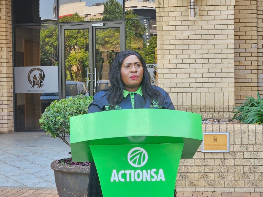 ActionSA member Mpumi Edwards read a memorandum at the head office of Public Servies Commission's