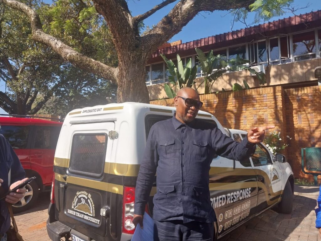 Dr Kgosi Maepa outside the Brooklyn police station