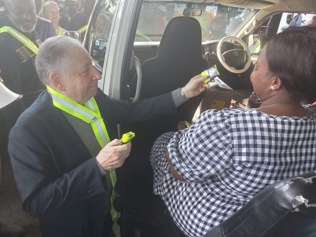 United Nations Special Envoy for Road Safety Jean Todt at the Bosman Taxi Rank in Tshwane handing out toad visibility belts to commuters' photo by Dimakatso Modipa