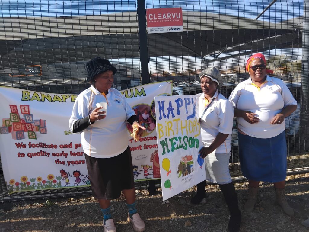 Brenda "Mama B" Mahlangu in red doek together with members of the Bana Pele Forum at the soup kitchen venue where jobseekers were fed with food in the Pretoria CBD