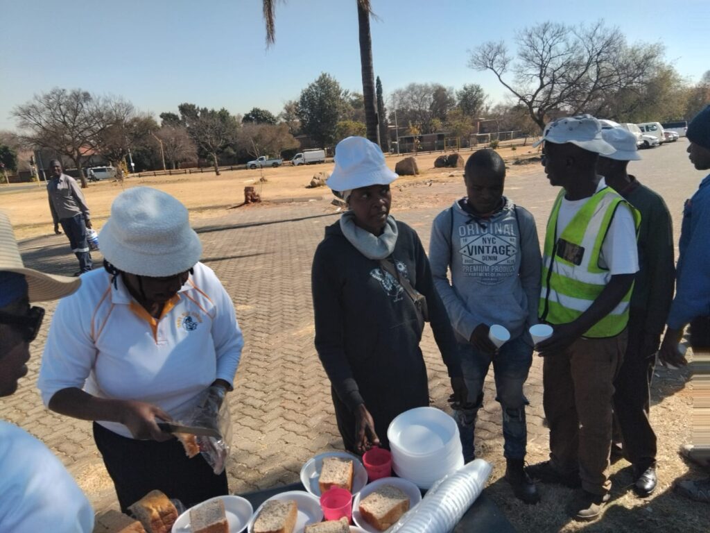 Members of Batho Pele Forum serving jobseekers with food on Thursday as part of their Mandela Day celebrations