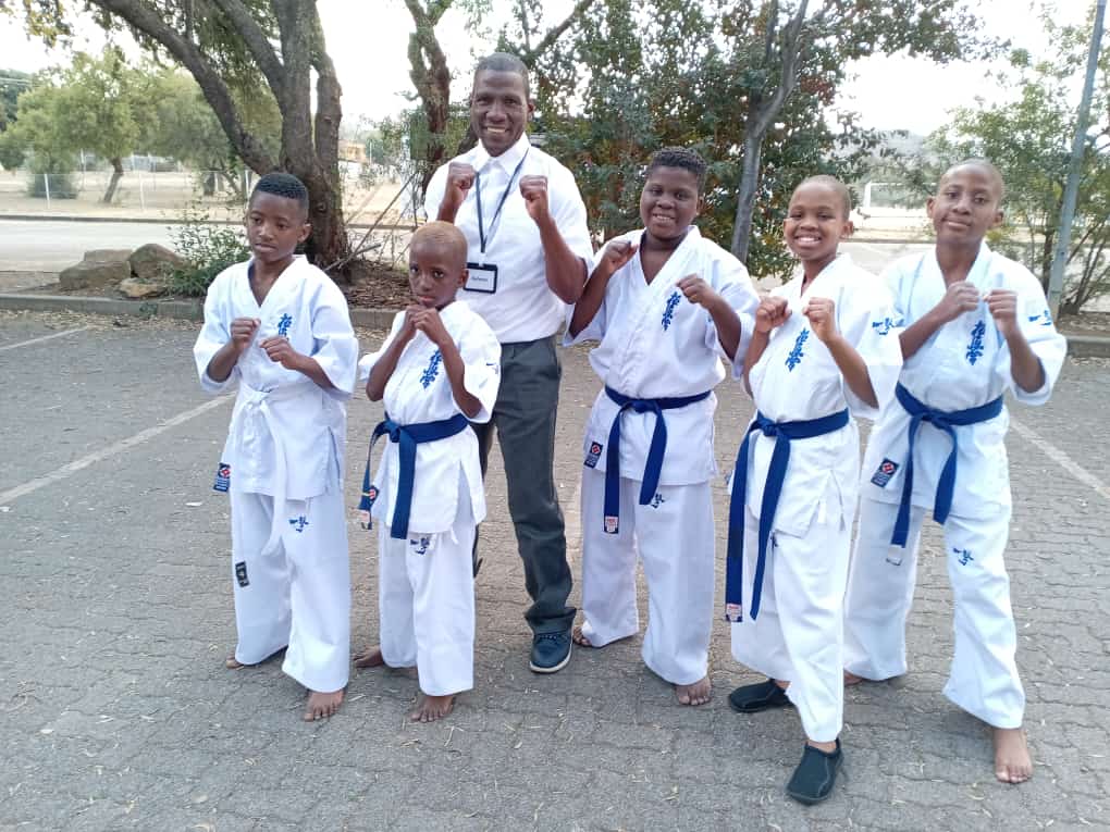 Mamelodi Karate Sensei Godfrey Tababe and young karate kids 