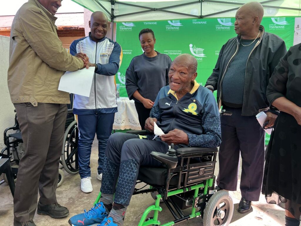 Legendary soccer star Lucas Masterpieces Moripe flanked by Dr Nasiphi Moya and other well-wishers