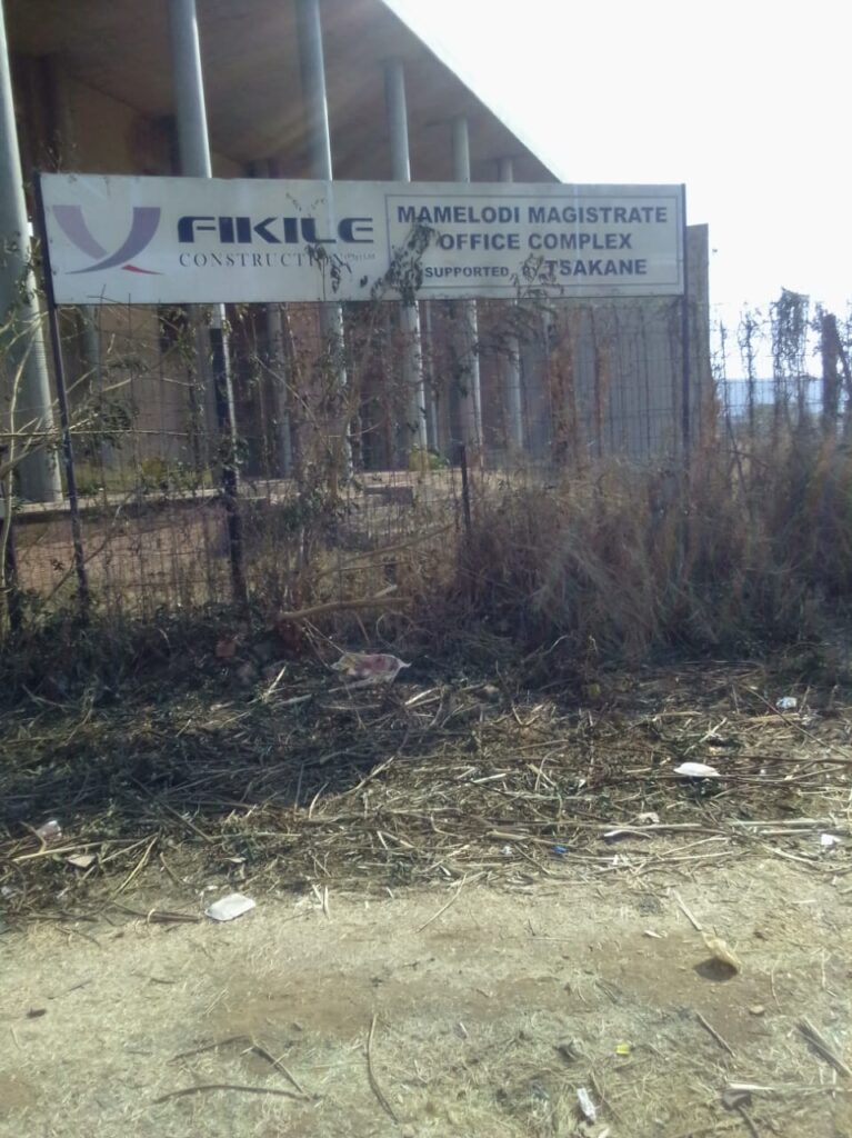 Signboard of Fikile Construction that was installed in 2013 when the building of the court started photo by Peter Mothiba