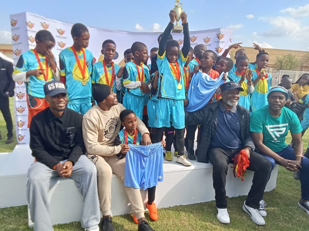 Pitso Mosimane football club under 12 won a trophy during a fellowship soccer tournament with soccer legends