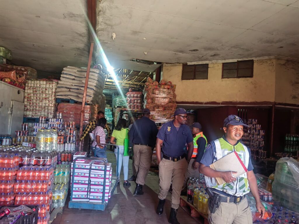 TMPD officials doing inspections inside a spaza shop