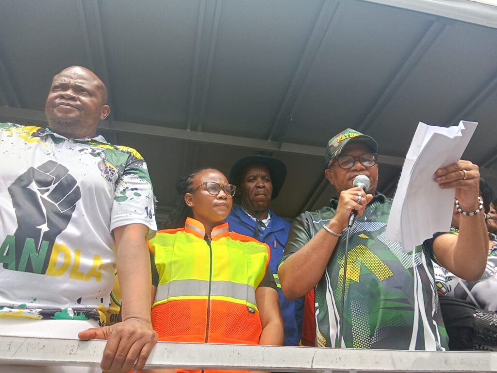 ANC Secretary general Fikile Mbalula reading a memorandum 