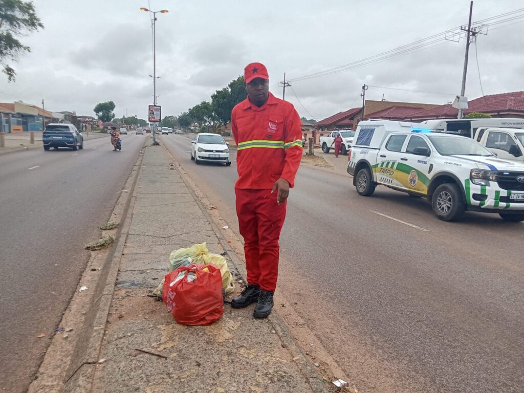 City of Tshwane MMC for Environmental Management and Agriculture Obakeng Ramabodu standing next to the rubbish on Tsamaya road in Mamelodi East 