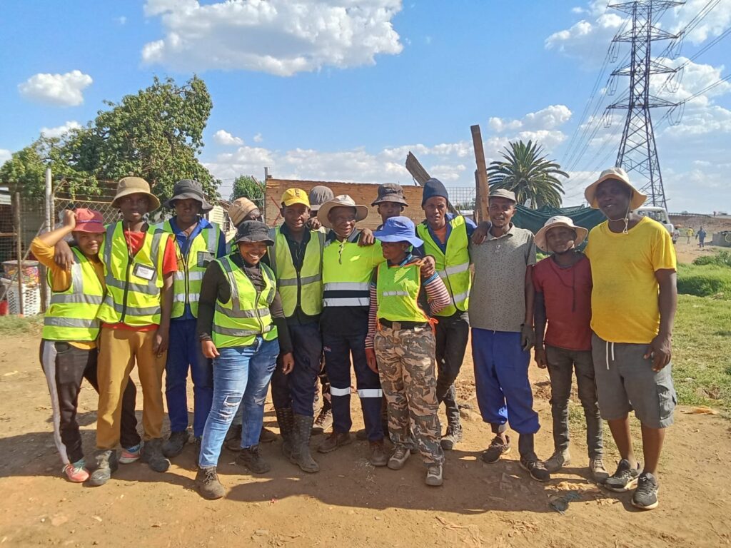 Ward 40 councillor Makola with some of the youth employeed at the relocation project photo by Dimakatso Modipa