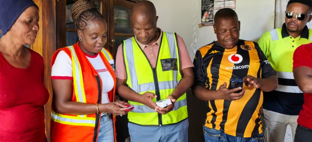 MMC for Utilities Frans Boshielo officially switched on electricity in there area accompany by ward councillor Mohalusi photo by Dimakatso Modipa