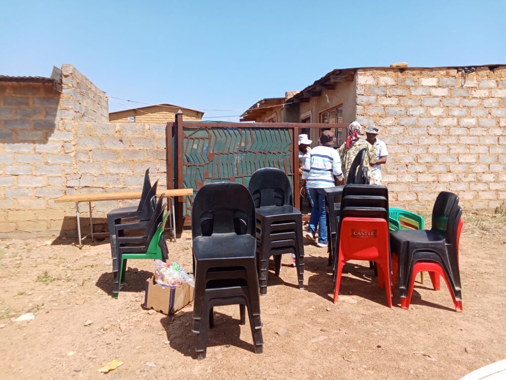 Community members removing furniture's from the illegal school 