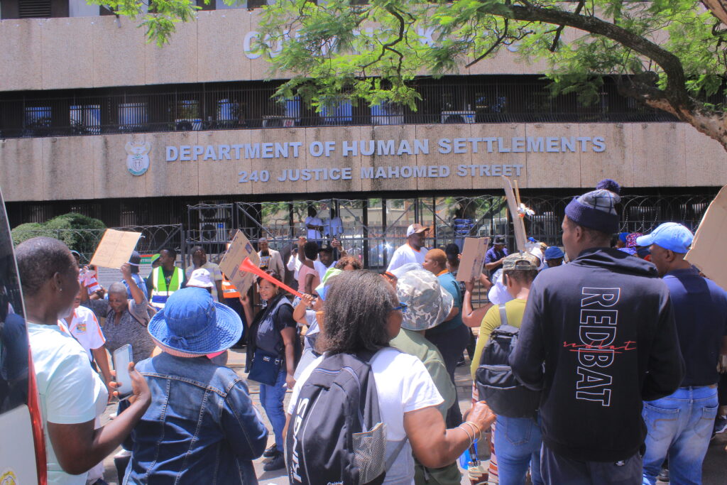 Beneficiaries of RDP houses march at the offices of human settlement in Pretoria 