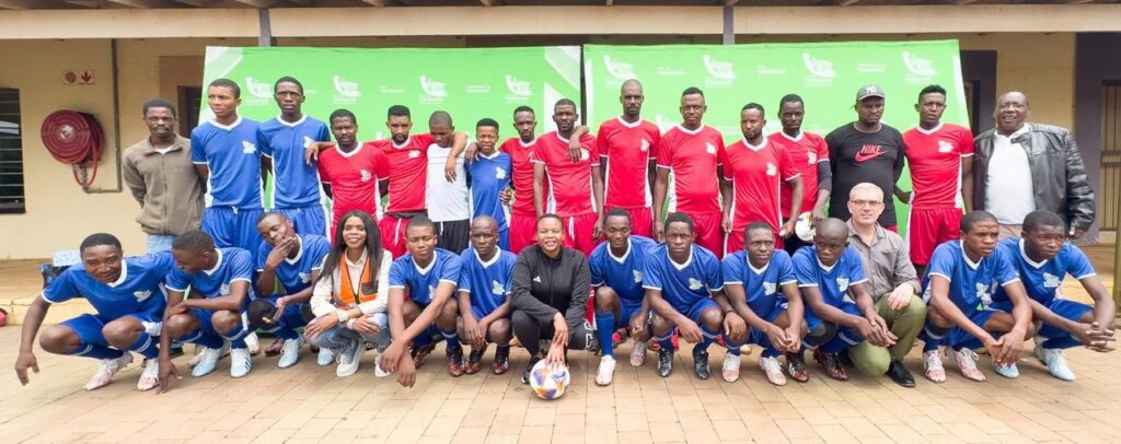 The handover ceremony of netball and soccer equipment to young players from Onverwacht in Region 5