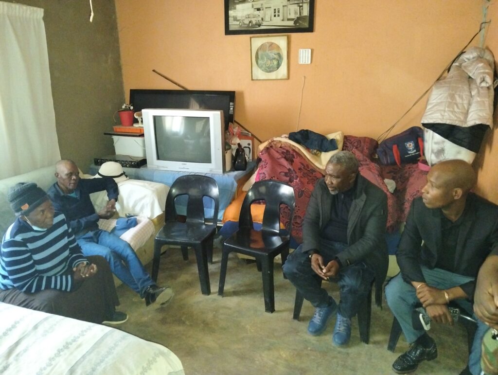 Chairperson of Mamelodi Local and Long Distance Taxi Association (MALLDTA) Stemmer Monageng accompanied by community leader Danny Mbiza with the aunt and father of the late Lethabo Matula photo by Dimakatso Modipa