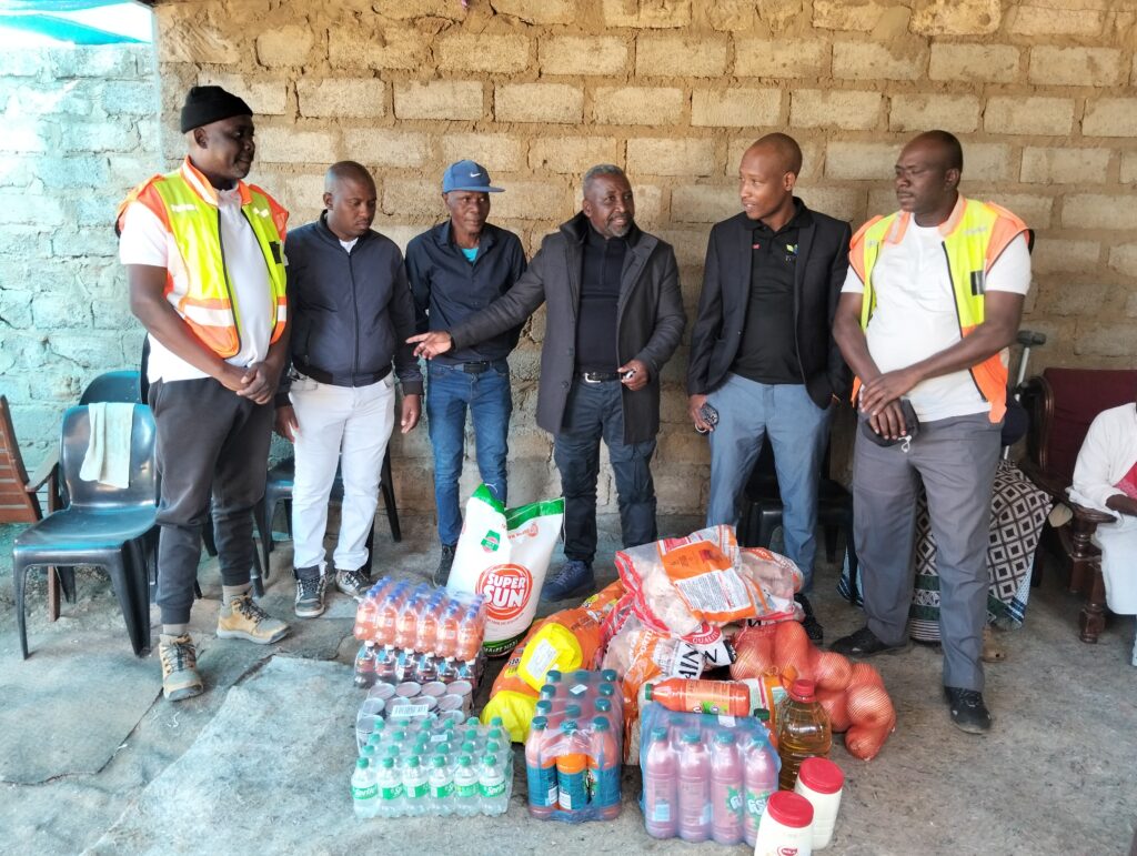Local and Long Distance Taxi Association (MALLDTA) Stemmer Monageng accompanied by community leader Danny Mbiza with the father of the late Lethabo Matula and monitoring team donating groceries photo by Dimakatso Modipa