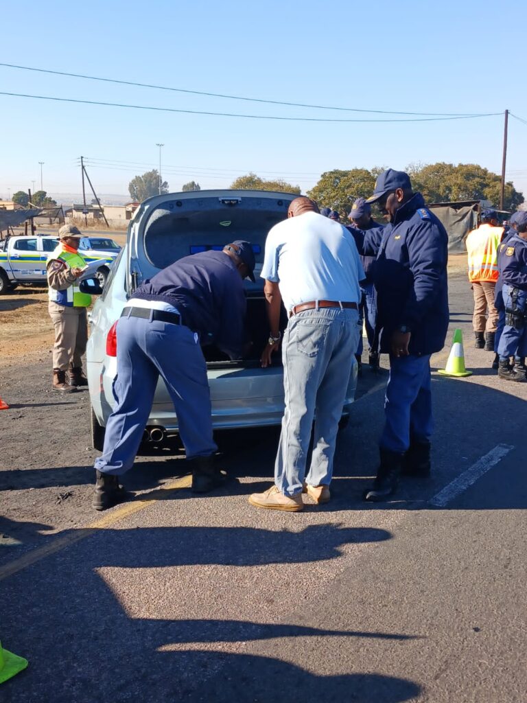 SAPS members inspecting a vehicle during operation sanela in Ekangala photo supplied 