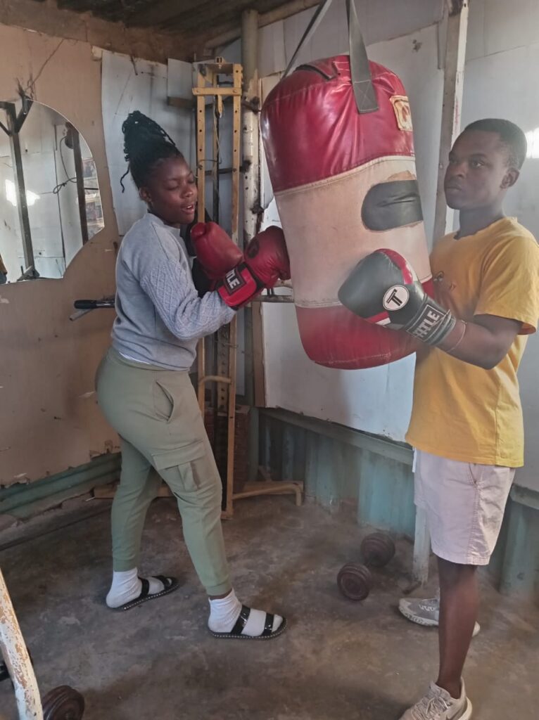 Lady boxer Kelebogile Maake with one of the boxers who are trained by David Mogale photo by Peter Mothiba 