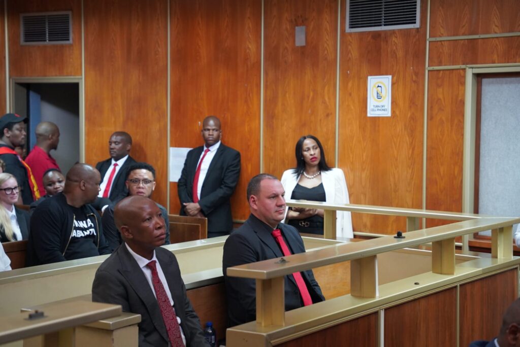 EFF leader Julius Malema with his bodyguard Adriaan Snyman in the dock at the East London Magistrates Court on Wednesday Photo by AfriForum