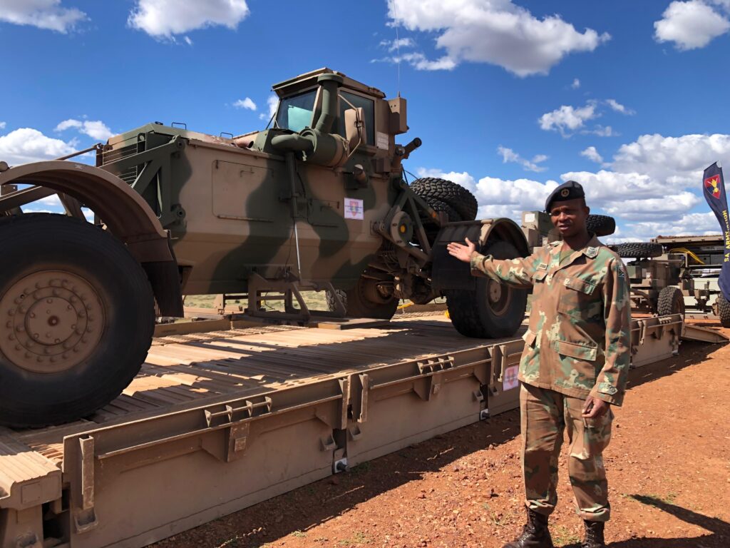 Staff Sergeant Leroibaki points at the Husky, a system used to detecting improvised explosive devices (IEDs) and mines Photo by Zinhle Bhuda
