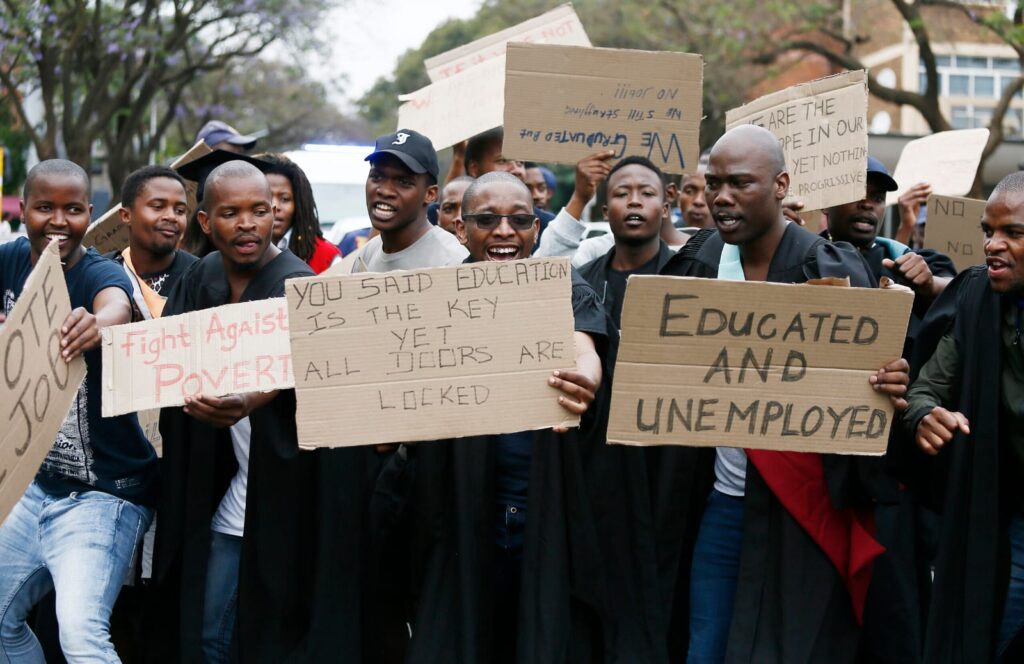 Unemployed graduates across the country protest wearing their graduation gowns