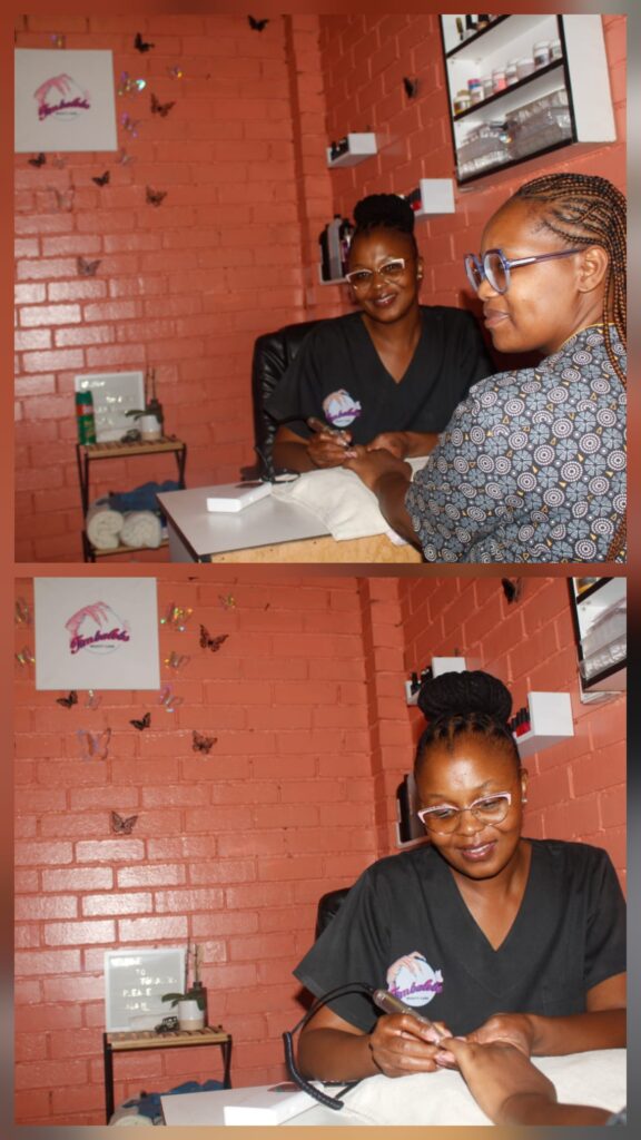 The stunning Lebogang Akinsuru, founder of Timbalebs Beauty Care, puts the finishing touches on a client's nails, ensuring perfection in every detail