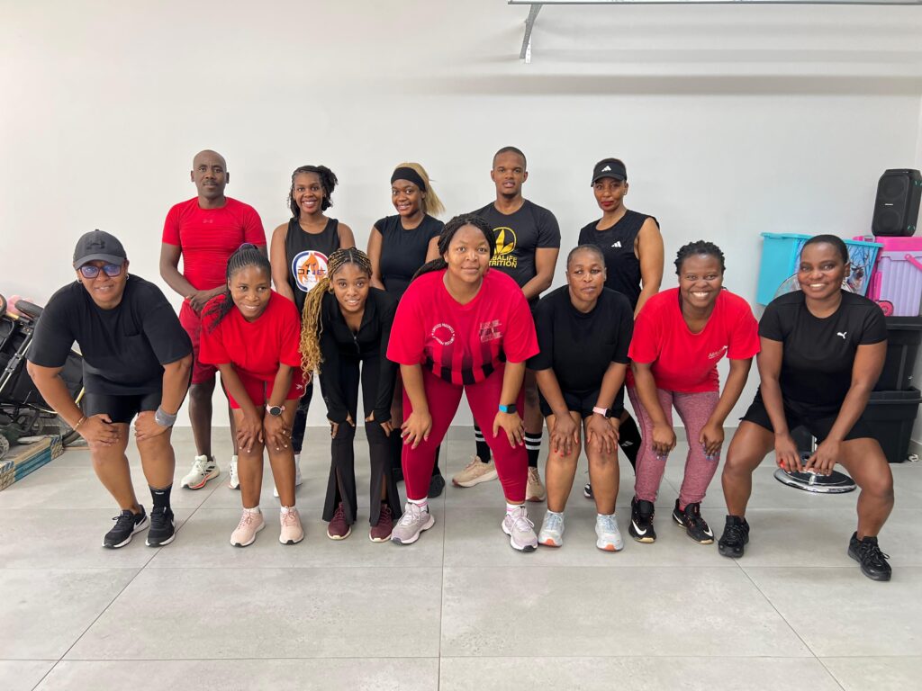 Black Diamond Steve pictured with his team in red gear at the far left