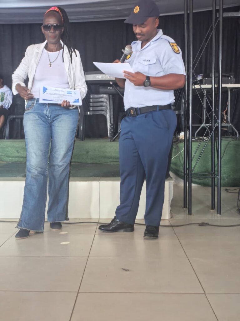 Stacey Mosehle with police officer who attended the Women's Day celebrations