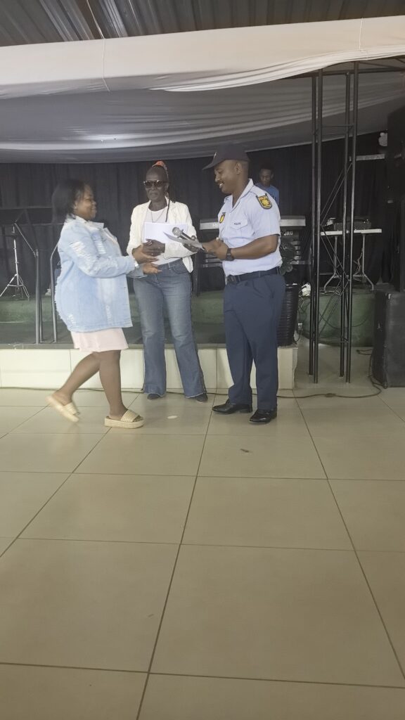 One of the participants in the programmes of Stacey Care Centre receiving her award