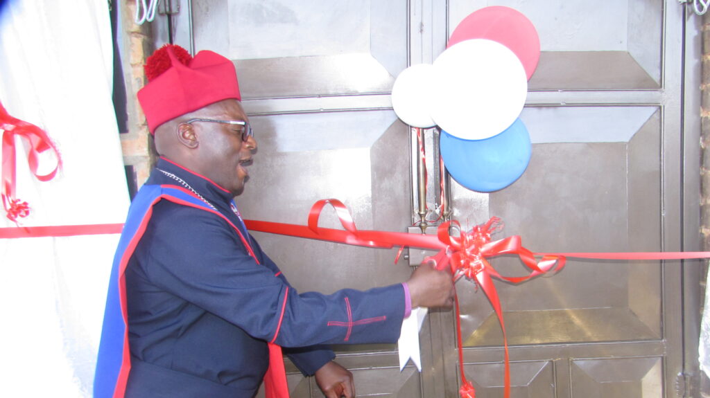 Bishop David Maeko of ZCM cutting a ribbon officially opening new church building photo by Dimakatso Modipa