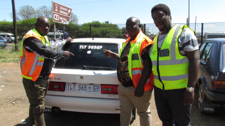 4 plus 1 taxi association members showing visible number plate on the wind screen in Tshwane Regional mall taxi rank in Mamelodi West Tshwane