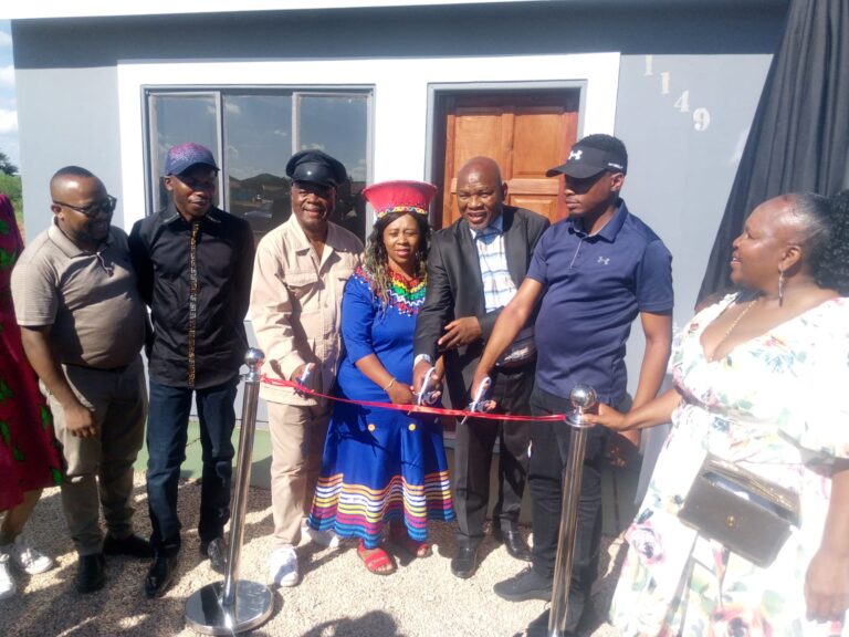 Member of Parliament Kenny Motsamai,, ward councilor Tshepo Kgatle, Solly Moholo cut a ribbon to a house belonging to Sibongile Zulu accompany by chairman of Rama City Mpho Thipe
