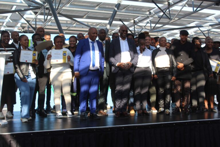 Happy residents of Mamelodi, Nellmapius and Eersterus holding their certificate with, CEO of TASEZ Dr Bheki Zulu and officials of TASEZ photo by Dimakatso Modipa