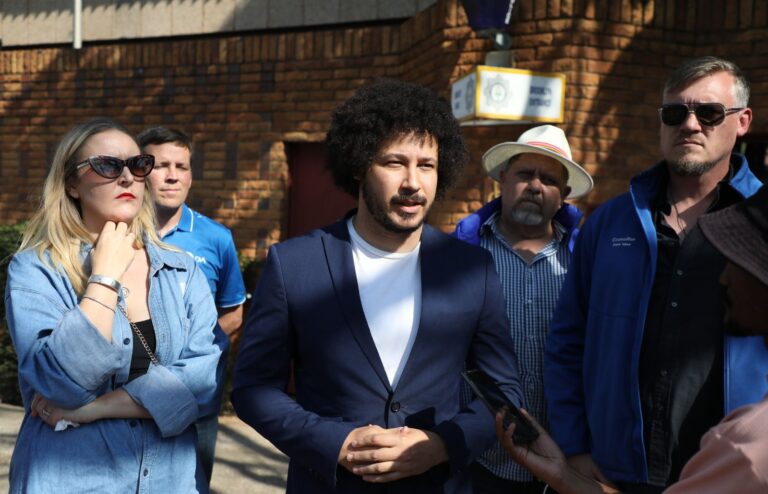 Tshwane DA members outside Brooklyn police station after opening a case Tshwane councilor against