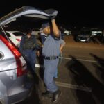 Gauteng Police boss Commissioner Tommy Mthombeni search a vehicle during Operation Shanela in Mamelodi