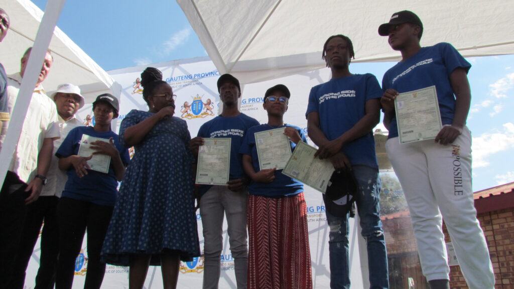 Gauteng MEC for Roads and Transport Kedibone Tlabela-Diale with some of the youth of Refilwe who passed their learner's license