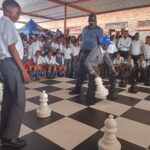 Gauteng Police Commissioner Lieutenant General Tommy Mthombeni playing chess with learners at Agnes Chidi primary school in Mamelodi photo by Dimakatso Modipa