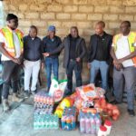 Local and Long Distance Taxi Association (MALLDTA) Stemmer Monageng accompanied by community leader Danny Mbiza with the father of the late Lethabo Matula and monitoring team donating groceries photo by Dimakatso Modipa