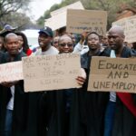 Unemployed graduates across the country protest wearing their graduation gowns