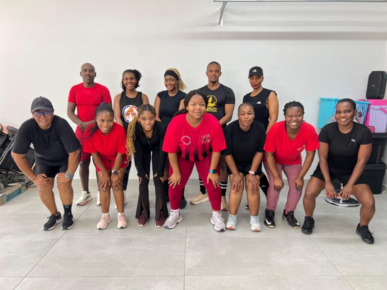 Black Diamond Steve pictured with his team in red gear at the far left
