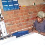 Peter Sithole of McLean Trading and Projects on top of what he knows best: tent manufacturing