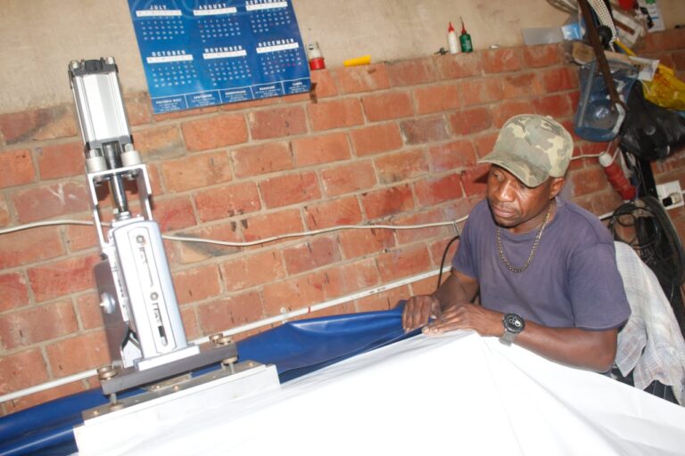 Peter Sithole of McLean Trading and Projects on top of what he knows best: tent manufacturing